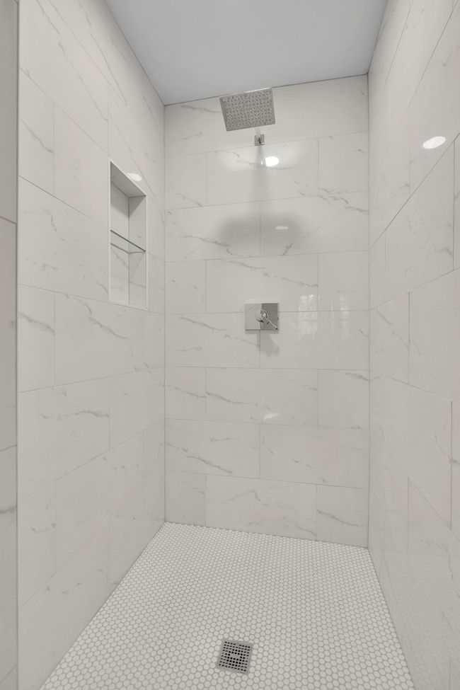Beautiful tiled walk in shower. | Image 25