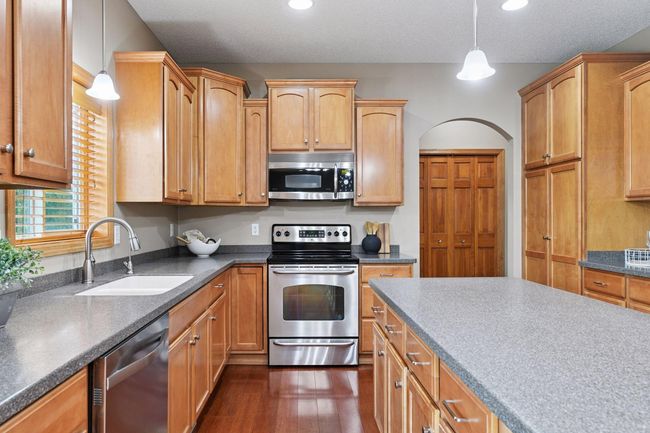 Maple cabinetry, stainless steel appliances and custom | Image 5