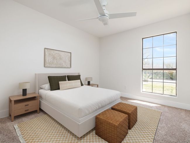Bedroom with a ceiling fan, baseboards, and light carpet | Image 5