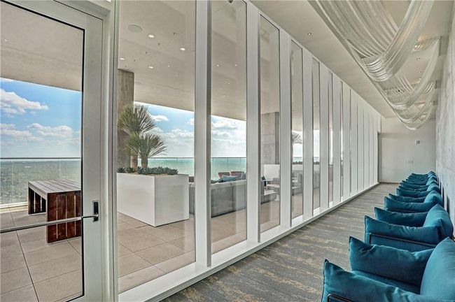 Doorway with a water view and tile patterned floors | Image 14