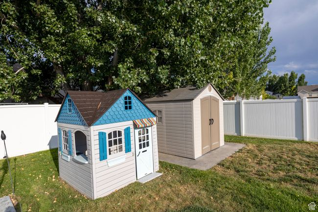 View of shed with a fenced backyard | Image 25