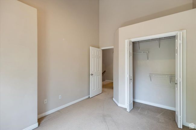 Bedroom featuring carpet flooring and a closet | Image 29