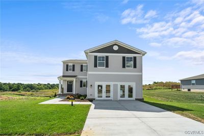 View of front facade featuring french doors and a front yard | Image 1