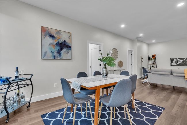 Dining space with wood finished floors, recessed lighting, and baseboards | Image 12
