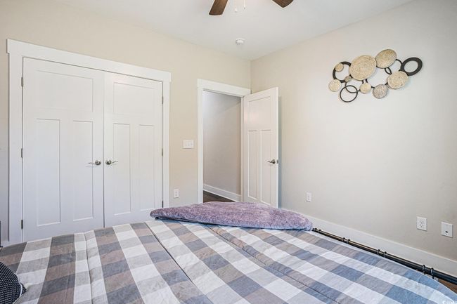 Unfurnished bedroom featuring ceiling fan and a closet | Image 18