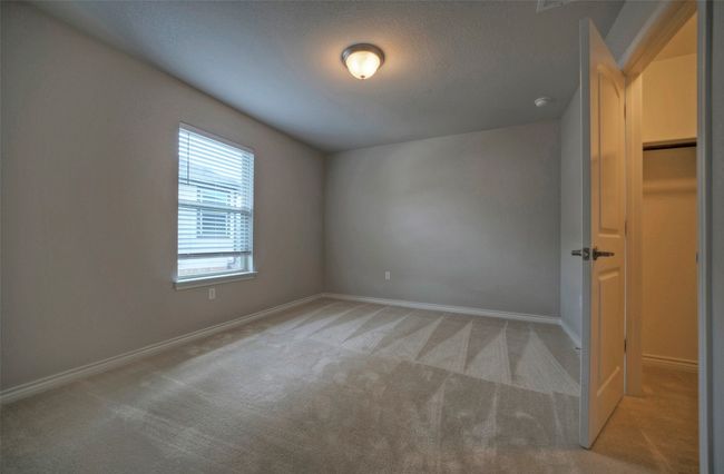 Spare room featuring light colored carpet and baseboards | Image 23
