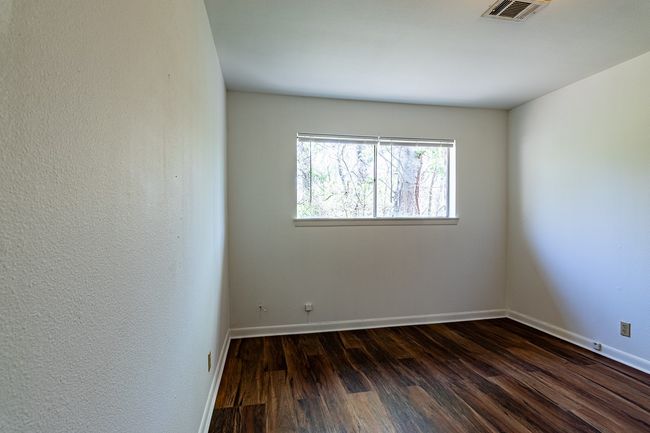 1214 Hunt - Bedroom featuring laminate floor | Image 14