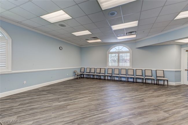 Spare room with baseboards, wood finished floors, and crown molding | Image 34