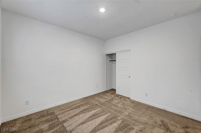 Unfurnished bedroom featuring a closet, carpet flooring, and baseboards | Image 47