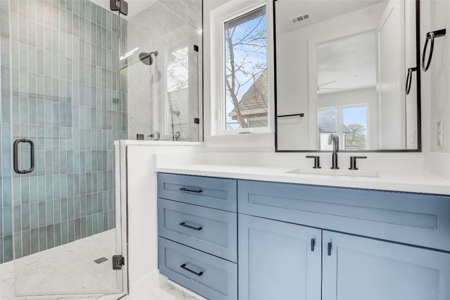 Full bath with vanity, a stall shower, and marble finish floors | Image 26