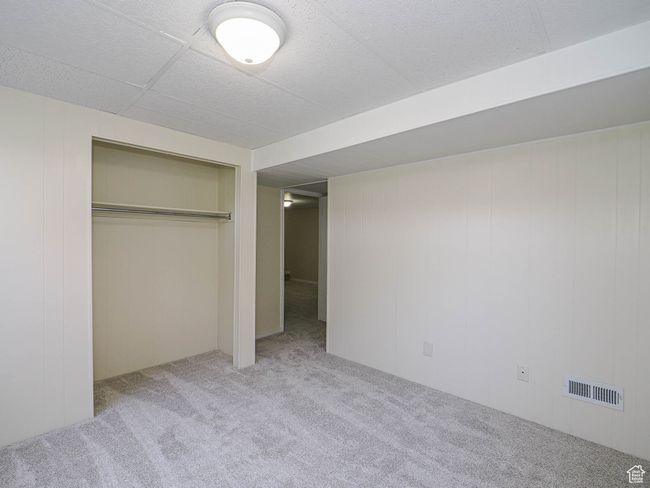 Unfurnished bedroom with carpet and a closet | Image 48