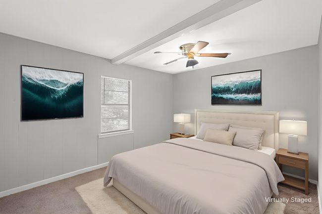Bedroom featuring carpet floors, beam ceiling, and ceiling fan | Image 10