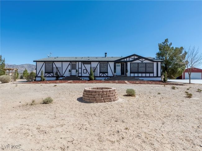 Back of property with an outdoor fire pit | Image 8