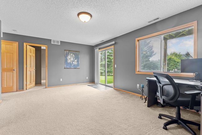 Enjoy this walkout lower level family room | Image 21