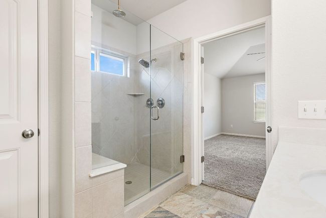 Full bathroom with a shower stall, baseboards, and a healthy amount of sunlight | Image 19