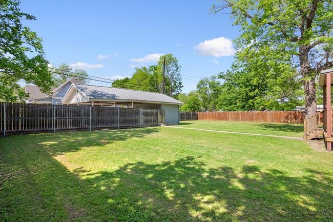 View of yard with a fenced backyard | Image 33