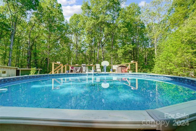 The above-ground pool with a deck provides the perfect spot for outdoor recreation. | Image 29