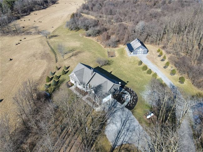 An overhead shot of the 3 bed/3bath OPEN CONCEPT ranch home and pole barn | Image 8