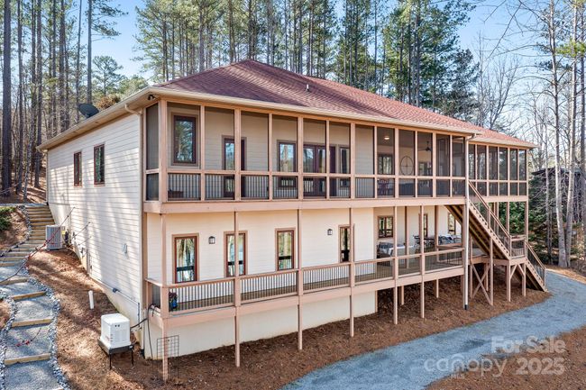 Two stories of decking for entertainng. Upper level is screened in and lower level is open. | Image 7
