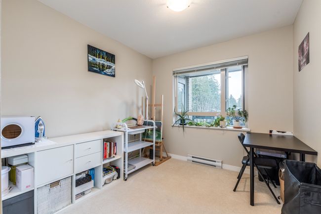 Carpeted home office featuring baseboards and baseboard heating | Image 16