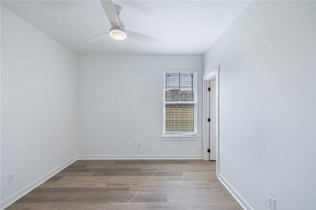 Unfurnished room with light wood-type flooring and ceiling fan | Image 25