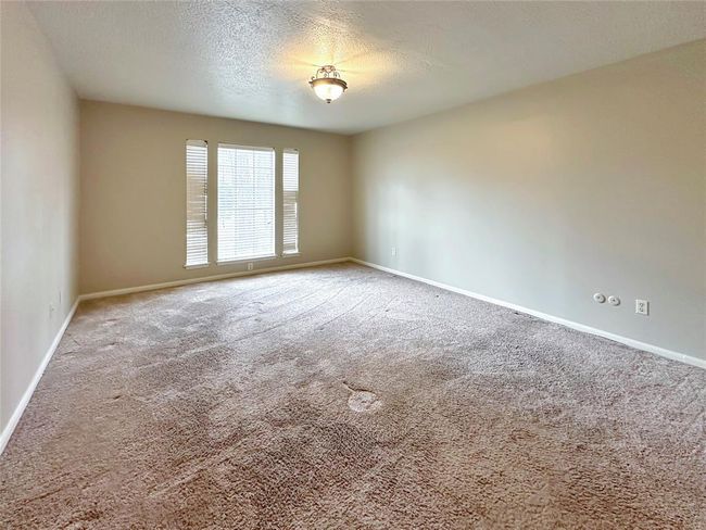 Primary bedroom is cozy and private. Located downstairs | Image 16