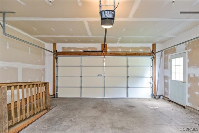 Garage featuring a garage door opener | Image 44