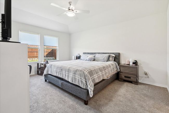 Carpeted bedroom with baseboards and a ceiling fan | Image 6