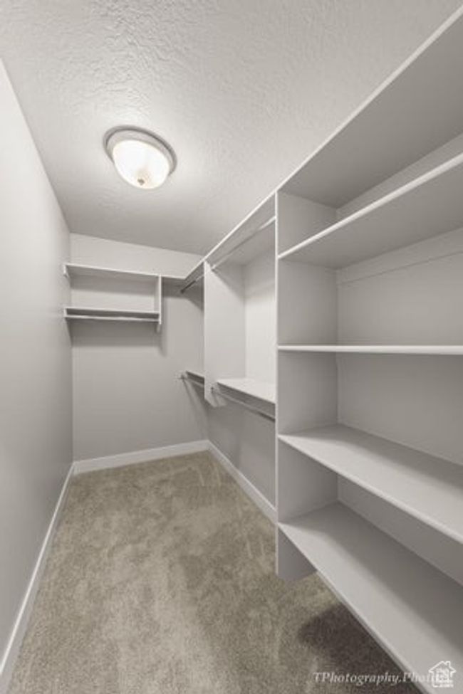Spacious closet with carpet floors | Image 18