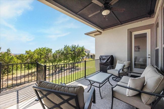 The covered back patio features a beautifully finished tongue and groove ceiling and a ceiling fan to keep the breeze flowing. Backing to a greenbelt, it offers natural privacy and enhances the spacious feel of the lot. Exterior Gas Stub allows an outdoor kitchen to be easily added. | Image 37
