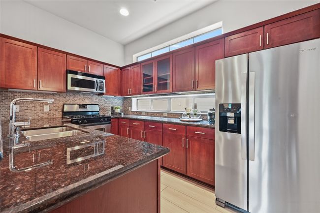 Granite counters and stainless steel appliances - side by side refrigerator included! | Image 11
