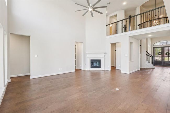 Gather around the stunning gas fireplace, the perfect focal point for family nights or holiday entertaining | Image 11