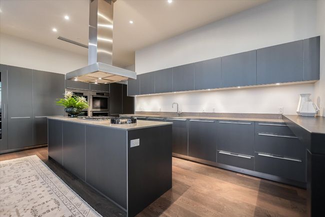 Outfitted with top-of-the-line Miele appliances, the kitchen blends professional-grade performance with minimalist beauty. | Image 15