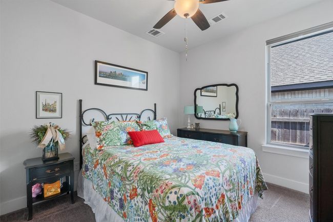 Carpeted bedroom with baseboards and a ceiling fan | Image 24