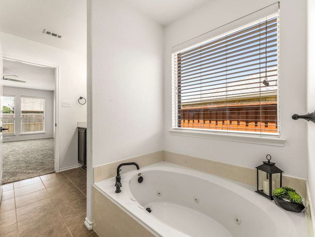 Full bathroom featuring a whirlpool tub and tile patterned floors | Image 21