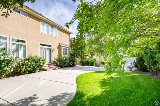 Large back patio with sliding door to family room | Image 37