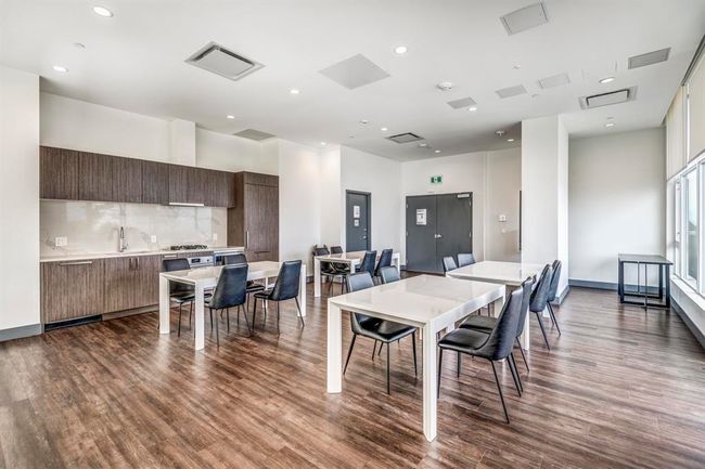 Dining room featuring dark wood finished floors and recessed lighting | Image 23