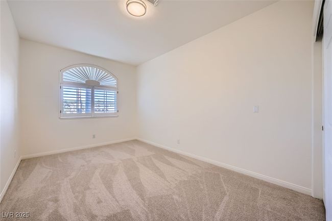 Spare room with light colored carpet and baseboards | Image 34