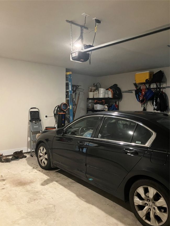Garage with a garage door opener | Image 25
