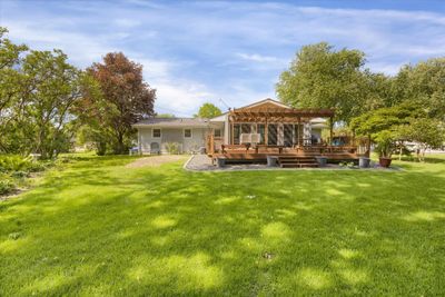 Large private back yard! Enjoy the days relaxing in the sunny 4 season porch & Deck! | Image 2