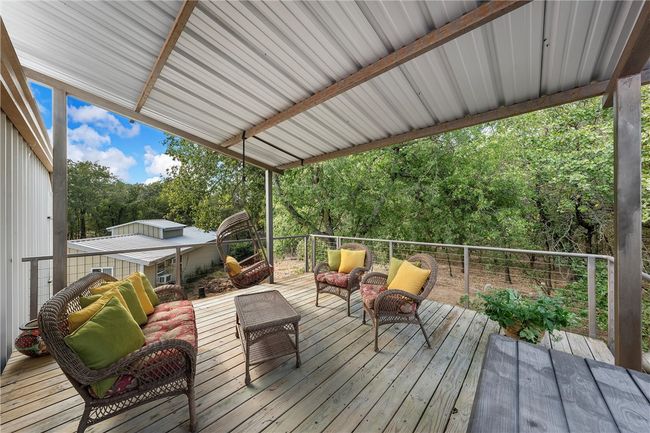 Upstairs outdoor covered deck off upstairs bedroom. | Image 24