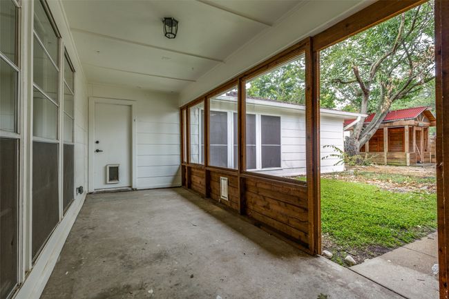 View of unfurnished sunroom | Image 23