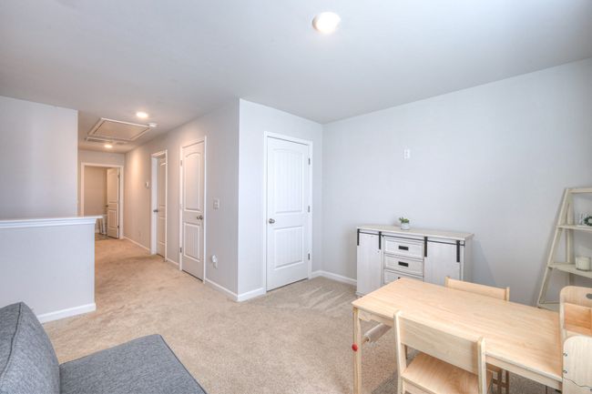 View from Bonus Room down the hall to the Bedrooms & Laundry Room | Image 12