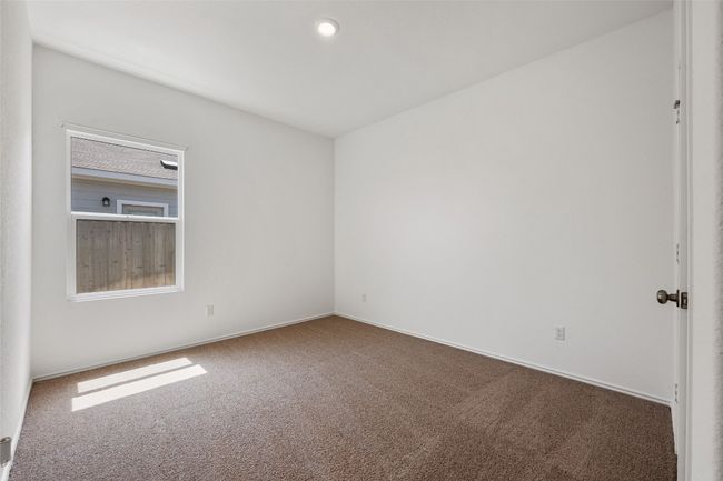 Carpeted empty room featuring baseboards | Image 26