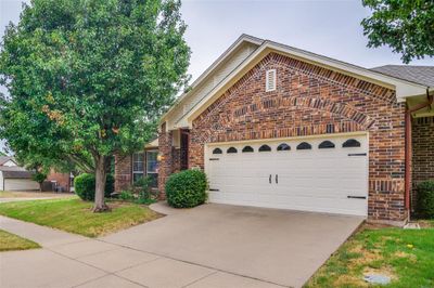 View of property with a garage | Image 2