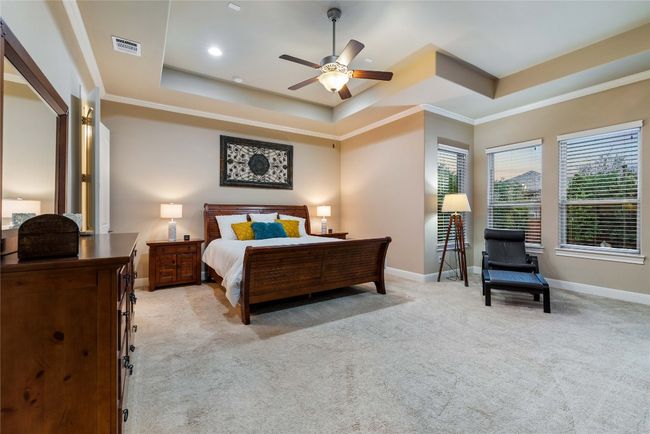 Large Primary Bedroom with Seating Area and Tray Ceilings | Image 20
