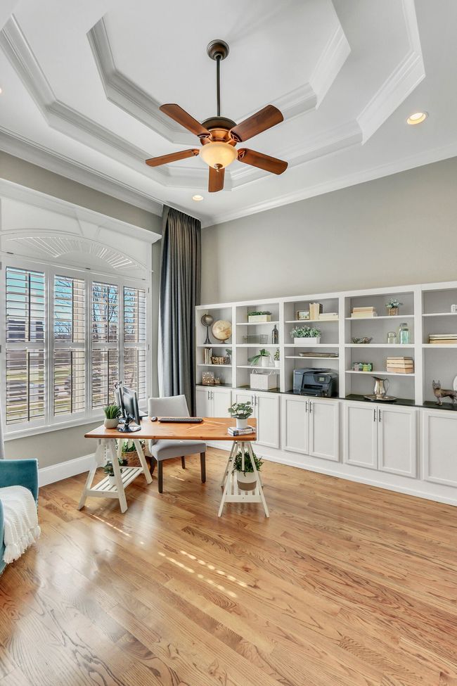 The formal living/office shows off high, trey ceilings. | Image 26