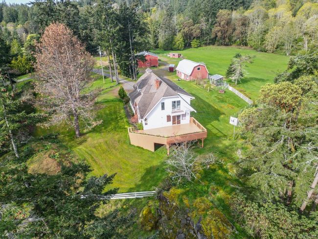 Aerial view of property and surrounding area featuring a forest | Image 54