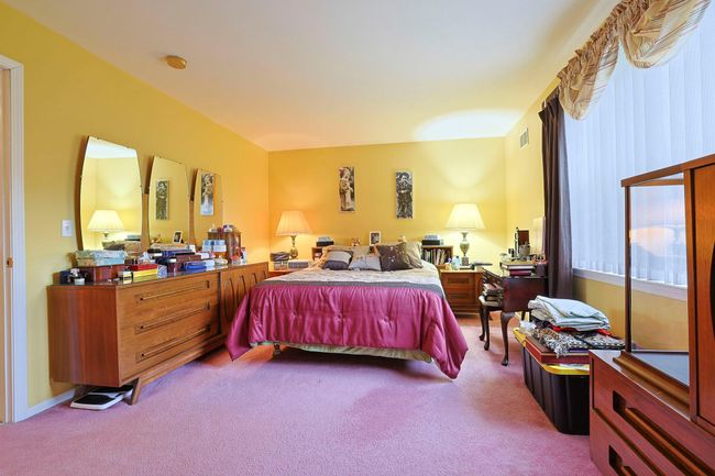 Bedroom featuring visible vents and carpet flooring | Image 17