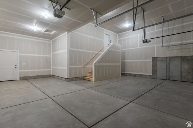Garage with a garage door opener | Image 19